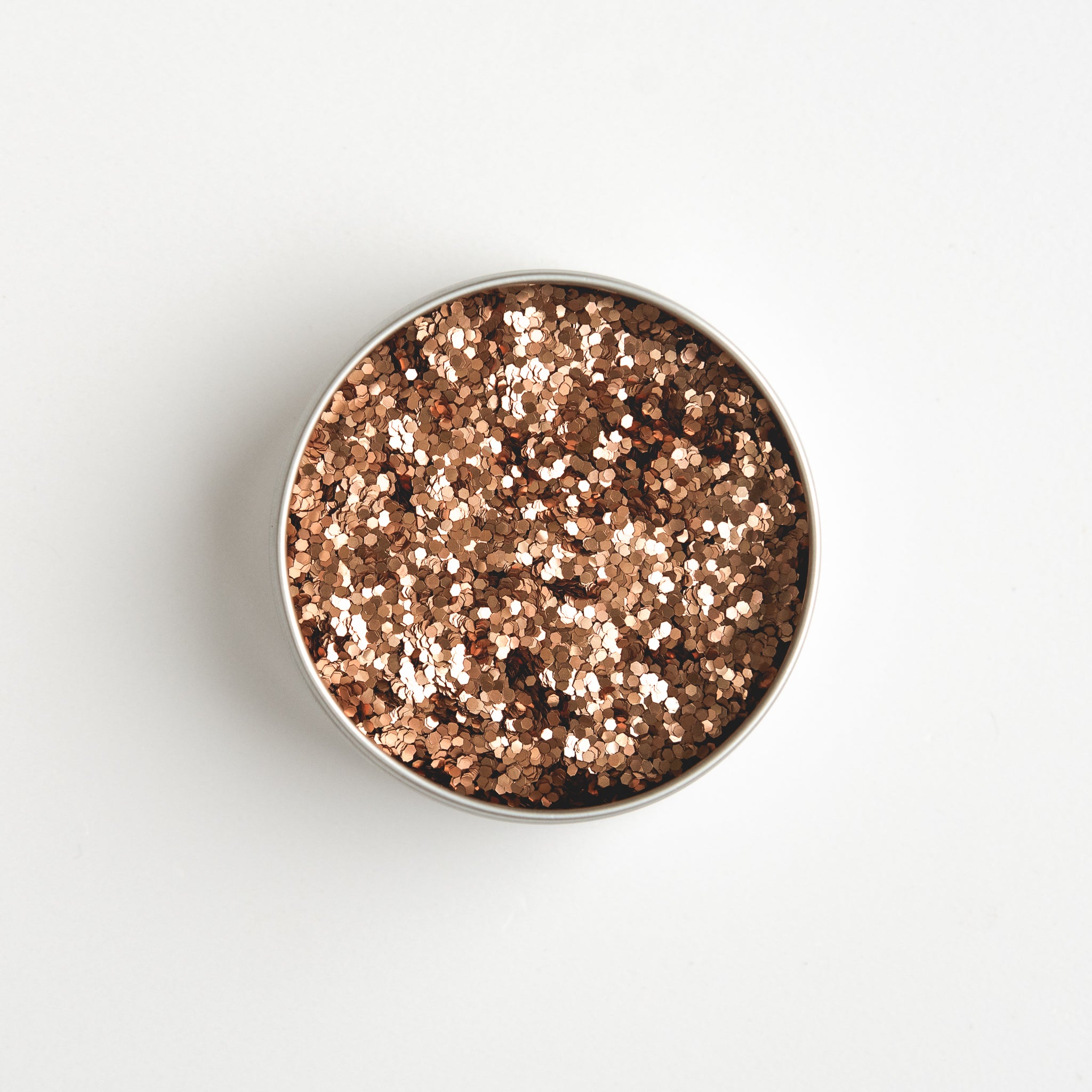 Close-up of The Glitter Tree Burnt Orange biodegradable cosmetic glitter pot showing the glitter inside