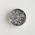 Close-up of The Glitter Tree Holo Silver biodegradable cosmetic glitter pot showing the glitter inside